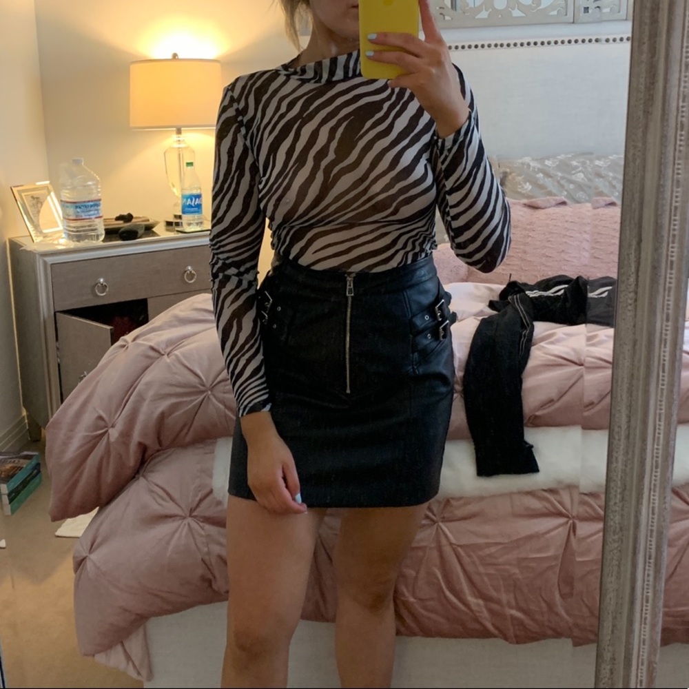 Black “leather” skirt with silver buckling